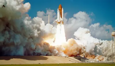 Space shuttle launching from Kennedy Space Center with massive exhaust clouds